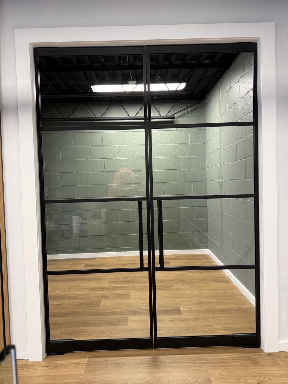 Glass partition with door closed